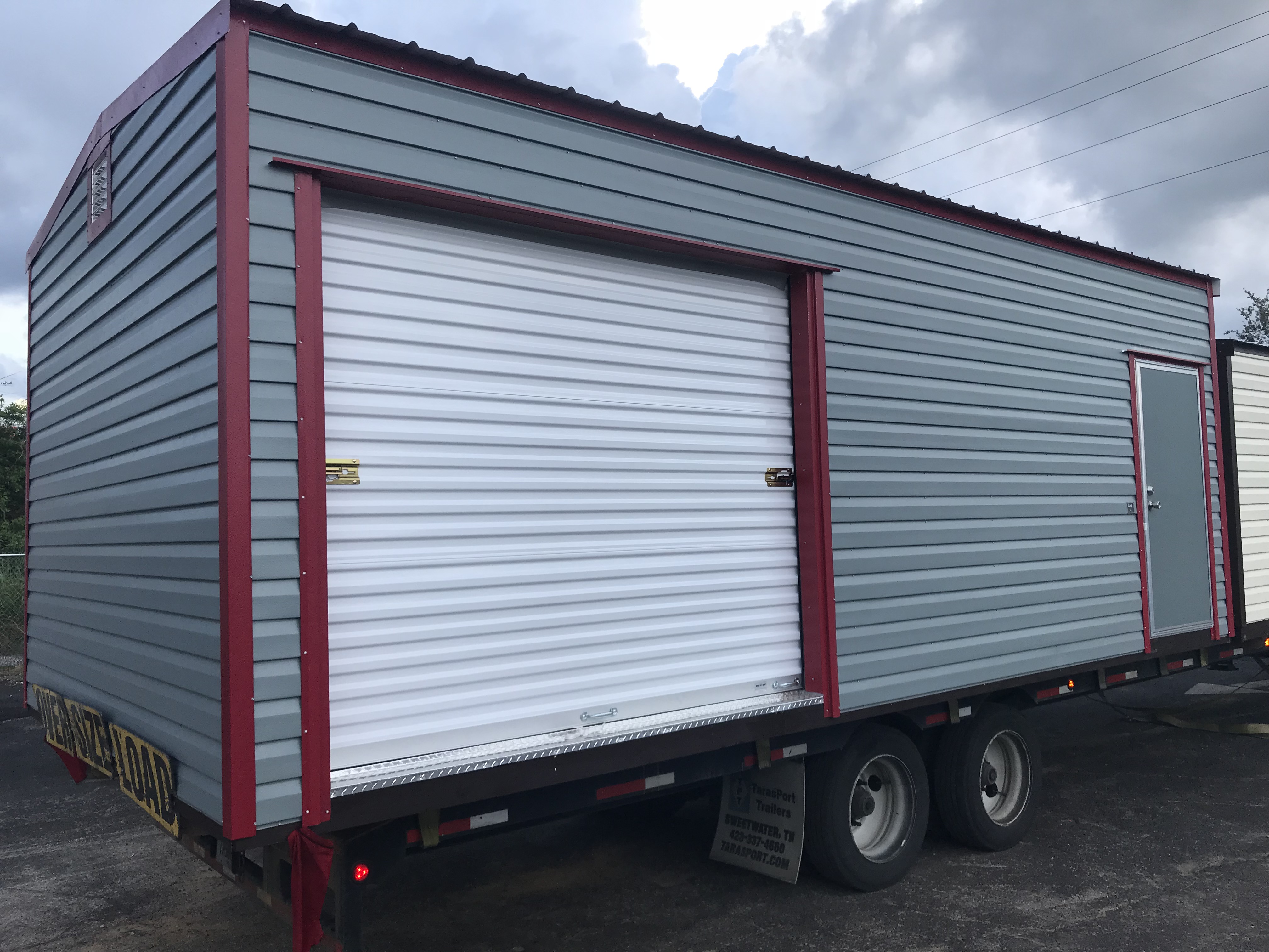 A large truck with a roll up door.